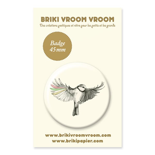 Badge - oiseau ailes colorées